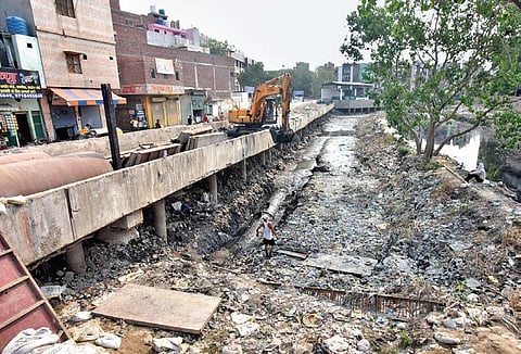 Civic agencies often leave the silt on the side of the drains after cleaning them | express