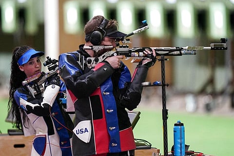 Mary Carolynn Tucker, left, and Lucas Kozeniesky, of the United States, compete in the mixed team 10-meter air rifle. (Photo | AP)
