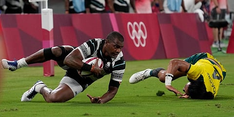 Fiji's Josua Vakurunabili, left, takes a tumble with Australia's Dietrich Peter Roache, in their men's rugby sevens quarterfinal match at the 2020 Summer Olympics in Tokyo, Japan. (Photo | AP)