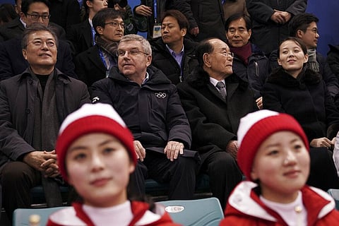 Kim Yo Jong, sister of North Korean leader Kim Jong Un, right, and North Korea's nominal head of state Kim Yong Nam, second right, sit next to Thomas Bach. (Photo | AP)