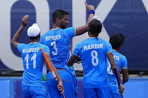 India's Rupinder Pal Singh (3) celebrates after scoring against Spain during a Men's field hockey match at the 2020 Summer Olympics. (Photo | AP)