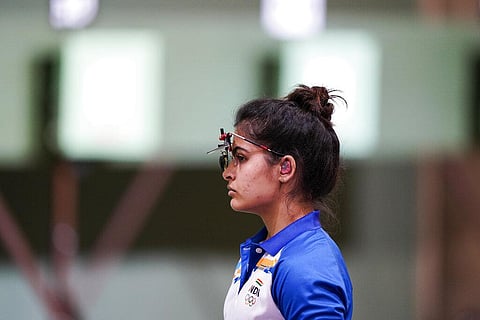 Manu Bhaker, of India, competes in the women's 10-meter air pistol at the Asaka Shooting Range in the 2020 Summer Olympics. (Photo | AP)