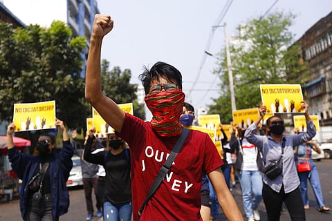 File photo anti-coup protesters gesture during a march in Yangon, Myanmar. (Photo | AP)