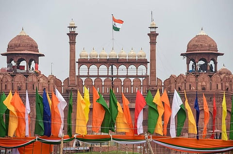 Indian national flag flutters atop the historic Red Fort on the eve of Independence Day in New Delhi  