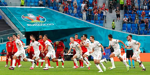 Spanish players celebrate after winning the Euro 2020 quarterfinal match against Switzerland. (Photo | AP)