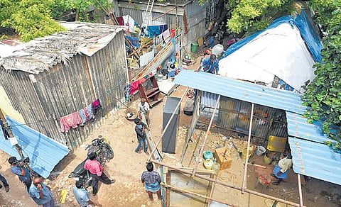 Encroachments being removed near the Cooum river at Arumbakkam | R Satish Babu