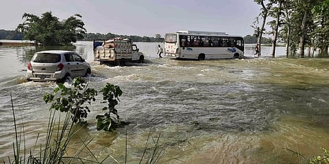 : Vehicles wade through a flooded area during the monsoon season, in Motihari, Bihar. (Photo | PTI)