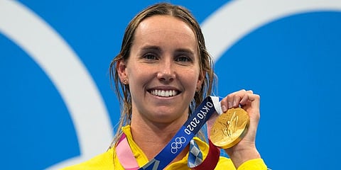 Emma Mckeon, of Australia, poses after winning the gold medal in the women's 50-meter freestyle final at the 2020 Summer Olympics in Tokyo, Japan. (Photo | AP)