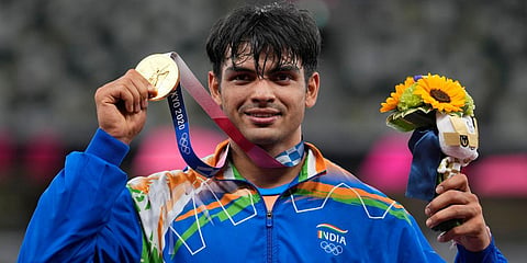 Gold medalist Neeraj Chopra, of India, poses during the medal ceremony for the men's javelin throw at the 2020 Summer Olympics. (Photo | AP)