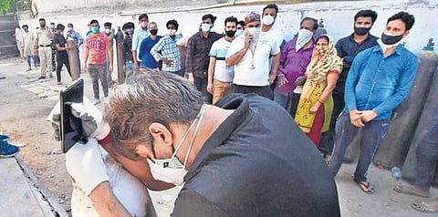File photo of people waiting to fill oxygen cylinders during the second wave of Covid 19. (File photo | PTI)