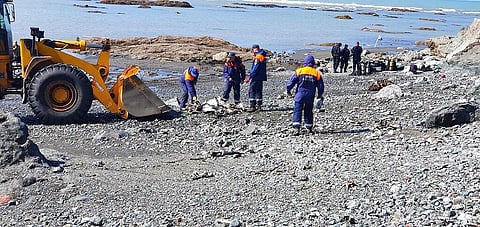 Emergency personnel work near the site where a helicopter carrying tourists crashed at Kurile Lake in the Kronotsky nature reserve on the Kamchatka Peninsula in Russia. (Photo | AP)