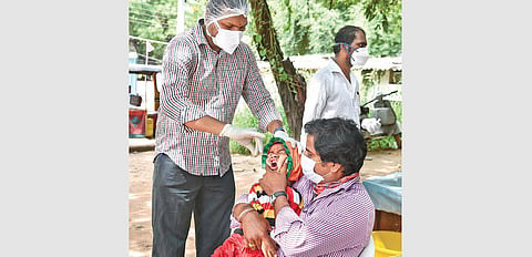 A child undergoes the Covid-19 test at Fever Hospital, on Thursday. (Photo | VINAY MADAPU)
