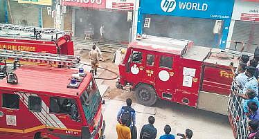 Fire tenders in action at Nehru Place in the city on Thursday | PTI