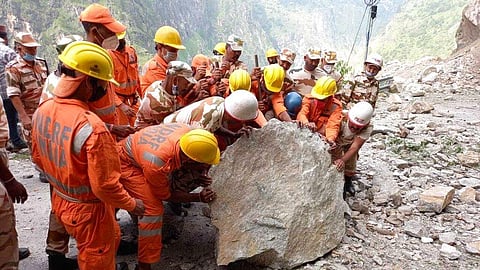 India's National Disaster Response Force (NDRF) shows NDRF soldiers working on a rescue operation at the site of a landslide in Kinnaur district in Himachal. 