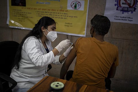 A man receives Covishield vaccine against the coronavirus at a government hospital in Noida. (File Photo | AP)