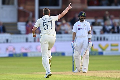 England's Ollie Robinson (L) celebrates taking wicket of India's Virat Kohli (R) on first day of second Test match at Lord's cricket ground in London on August 12, 2021. (Photo | AFP)
