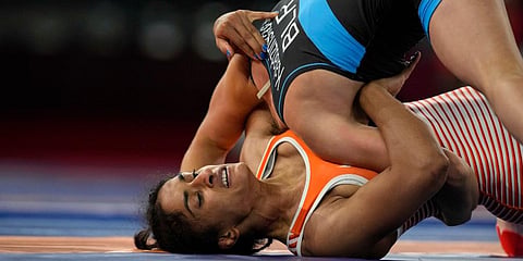 India's Vinesh Phogat competes with Belarus' Vanesa Kaladzinskaya Tiako during the women's 53kg Freestyle wrestling eight final match at the 2020 Summer Olympics in Tokyo, Japan. (File Photo | AP)