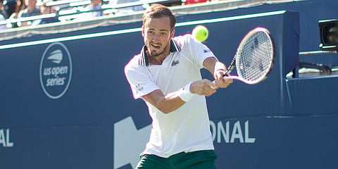 Daniil Medvedev hits a backhand return during his win over Reilly Opelka in National Bank Open men's doubles final action in Toronto. (Photo | AP)