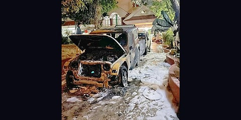 BJP MLA Satish Reddy’s car that was torched by miscreants. (File photo| EPS)