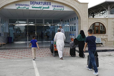 Passengers enter the departures terminal of Hamid Karzai International Airport, in Kabul, Afghanistan. (Photo | AP)