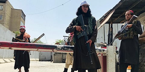 Taliban fighters stand guard at a checkpoint near the US embassy that was previously manned by American troops, in Kabul. (Photo| AP)