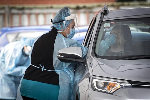 A driver has a COVID-19 test at a driver through clinic in Auckland, New Zealand, Thursday, Aug. 19, 2021. (Photo | AP)