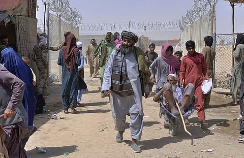 FILE | Afghan people enter into Pakistan through a border crossing point, in Chaman, Pakistan. (Photo | AP)
