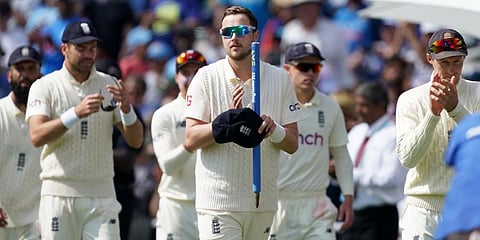 England's Ollie Robinson (c) and teammates walk off the field after their win on the fourth day of third test match against India, at Headingley cricket ground in Leeds. (Photo | AP)