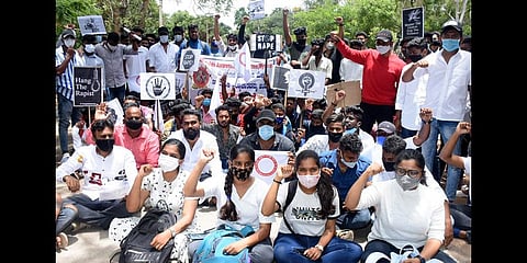 Students protest demanding that the state government arrest the accused involved in the recent gang-rape of a college student, in Mysuru on Friday   |  Udayshankar S