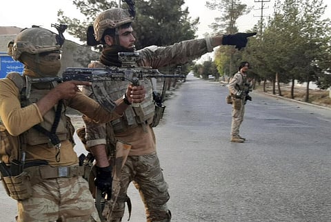 Afghan Special forces patrol a deserted street during fighting with Taliban fighters, in Lashkar Gah, Helmand province, southern Afghanistan (Photo | AP)