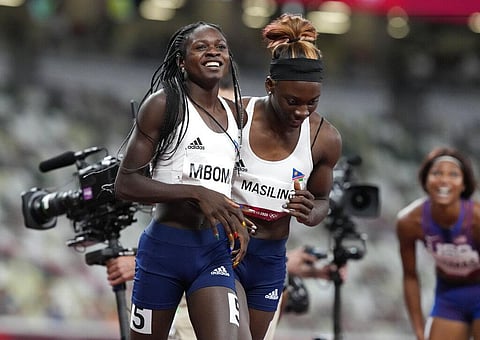 Christine Mboma, of Namibia, celebrates with Beatrice Masilingi, of Namibia after winning the silver medal in the final of the women's 200-meter. (Photo | AP)
