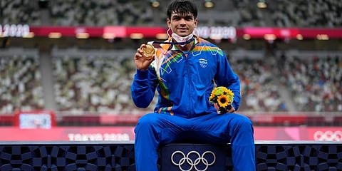 Gold medalist Neeraj Chopra, of India, poses during the medal ceremony for the men's javelin throw at the 2020 Summer Olympics, Saturday, Aug. 7, 2021, in Tokyo. (Photo | AP)