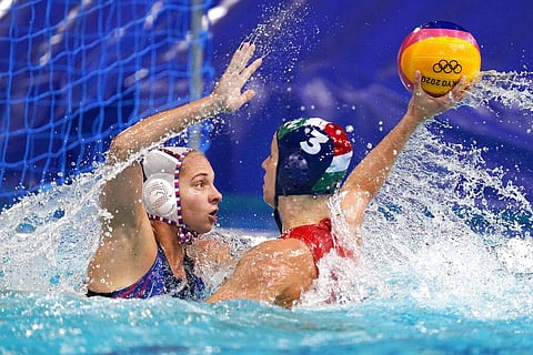 Hungary's Vanda Valyi (3) passes the ball as she is defended by Alena Serzhantova, left, of the Russian Olympic Committee, during a preliminary round women's water polo match. (Photo | AP)