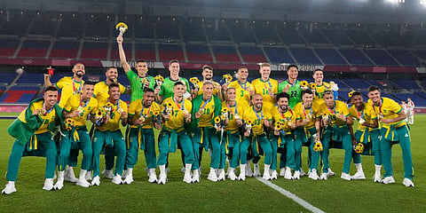 Players of Brazil pose with their gold medals after defeating Spain in the men's soccer final match at the 2020 Summer Olympics in Yokohama, Japan. (Photo | AP)