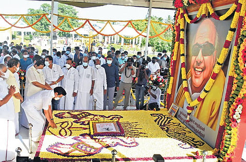FILE - CM MK Stalin paying floral tributes to his father and the late DMK leader  M Karunanidhi at his memorial on the Marina.