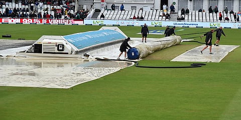 Groundsmen pull on the covers after rain delayed start of the fifth day of first Test cricket match between England and India, at Trent Bridge in Nottingham. (Photo | AP)