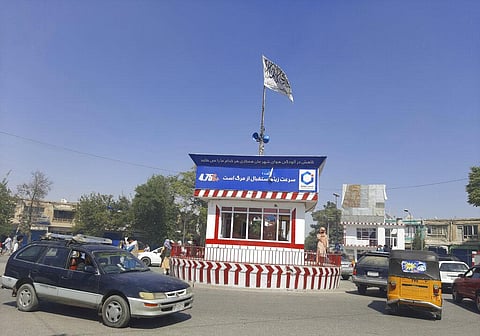 A Taliban flag flies in the main square of Kunduz city after fighting between Taliban and Afghan security forces, in Kunduz, Afghanistan, Sunday, Aug. 8, 2021. (Photo | AP)