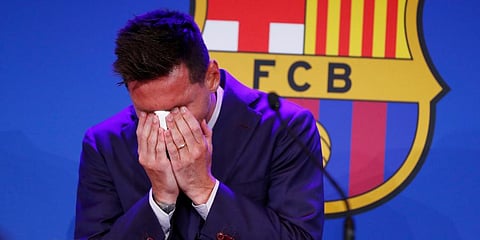 Lionel Messi cries at the start of a press conference at the Camp Nou stadium, where he announced his exit from his boyhood club, in Barcelona, Spain. (Photo | AP)