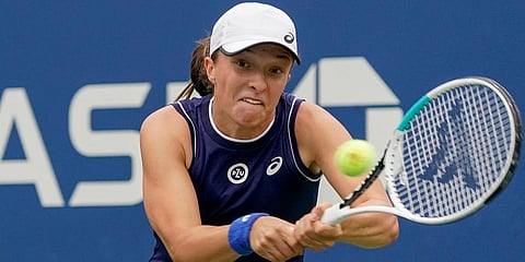 Iga Swiatek returns a shot to Jamie Loeb during the first round of the US Open tennis championships in New York. (Photo | AP)