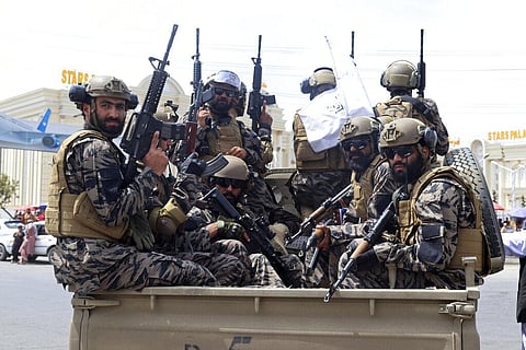 Taliban special force fighters arrive to the Hamid Karzai International Airport after the U.S. military's withdrawal. (Photo | AP)