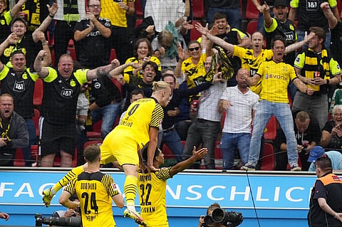 Dortmund's Jude Bellingham and Erling Haaland celebrate a goal during Bundesliga match against Bayer Leverkusen on Saturday. (Photo | AP)