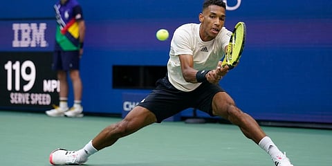Felix Auger-Aliassime returns a shot to Daniil Medvedev during the semifinals of the US Open tennis championships in New York. (Photo | AP)