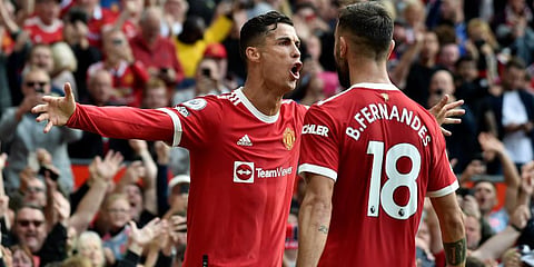 Cristiano Ronaldo celebrates after scoring the opening goal during the EPL match between Manchester United and Newcastle United at Old Trafford stadium in Manchester. (Photo | AP)