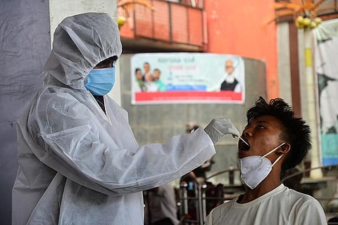 A medic collects a swab sample (File photo | Ashishkrishna HP, EPS)