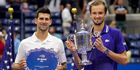 Daniil Medvedev (R) and Novak Djokovic pose for photos after the men's singles final of the US Open tennis championships in New York. (Photo | AP)
