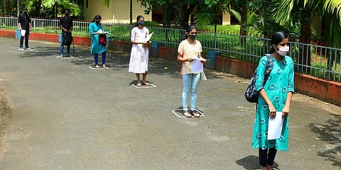 Students going through Covid19 screenings before entering the JEE exam centre. (File Photo | TP Sooraj, EPS)