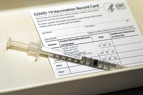 A syringe containing a dose of the Pfizer COVID-19 vaccine sits in a container during a vaccine clinic at Providence Alaska Medical Center. (Photo | AP)