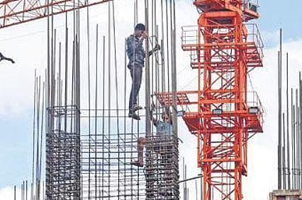 Building worker busy at a construction site