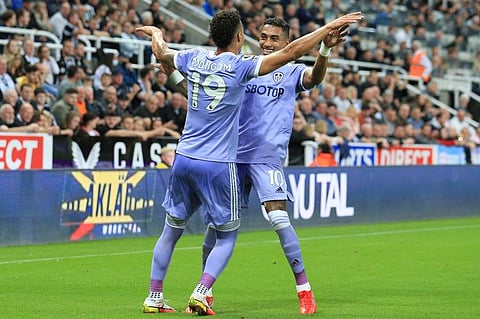 Leeds United players Raphinha Dias Belloli (R) and Rodrigo (L) celebrate after scoring goalduring match against Newcastle United at St James' Park, north east England. (Photo | AFP)