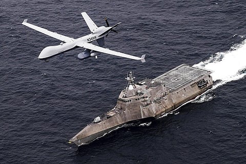 An MQ-9 Sea Guardian unmanned maritime surveillance drone flies over the USS Coronado in the Pacific Ocean during a drill April 21, 2021. (Photo | AP)